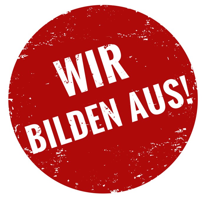 Wir bilden aus Ein roter Stempel mit der Inschrift "Wir bilden aus"