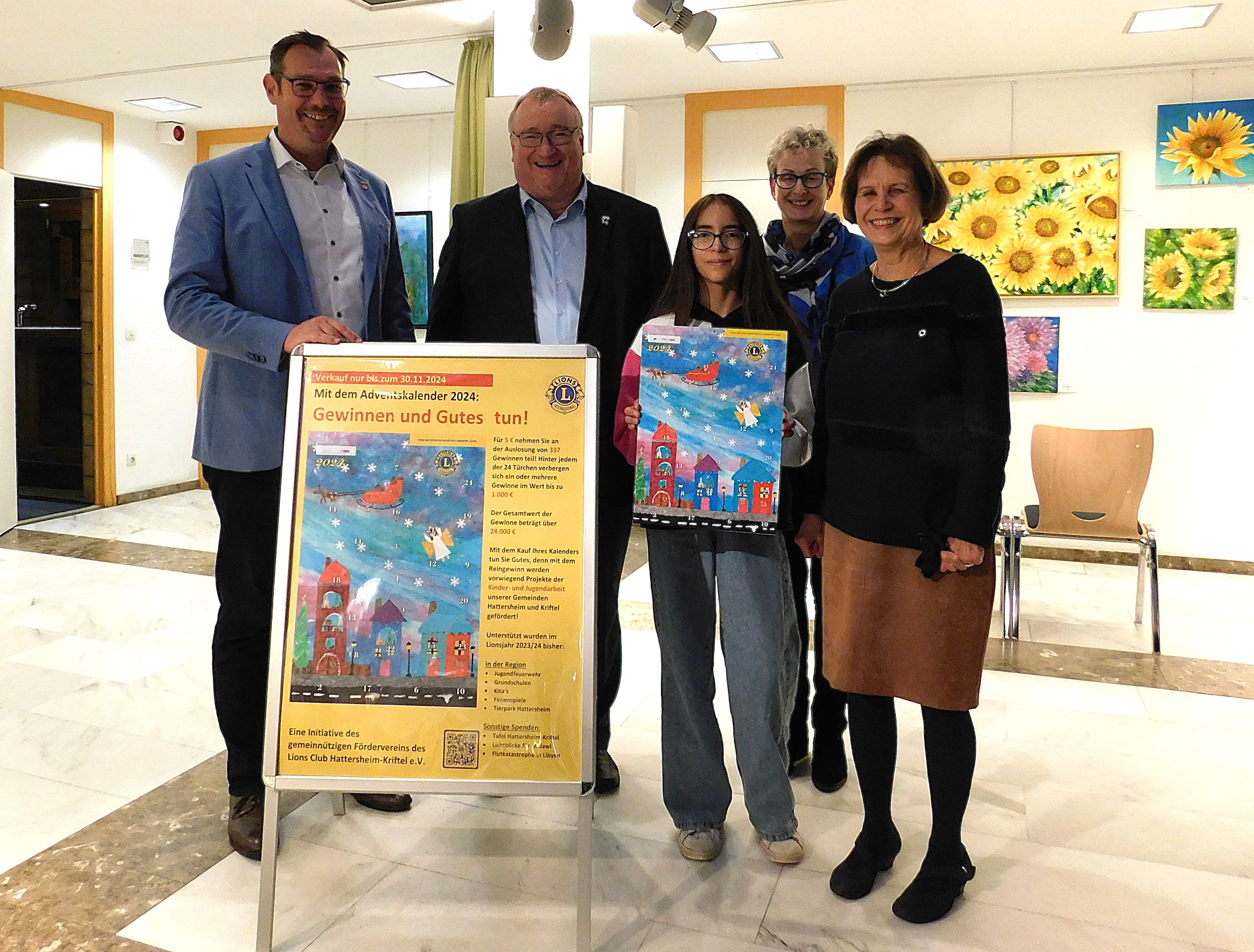 Promis mit Adventskalender und Schülerin.