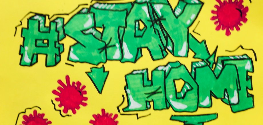 Ein Graffiti mit der Aufschrift Stay Home.